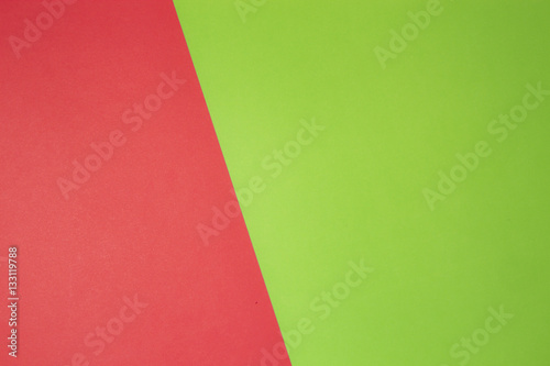 Greenery and red colored paper background