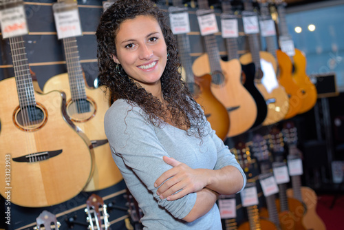 Portrait of woman in guitar shop
