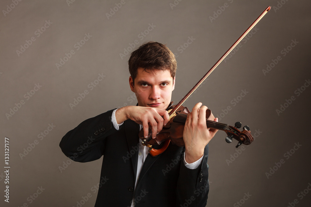 Man man dressed elegantly playing violin Man man dressed elegantly playing violin