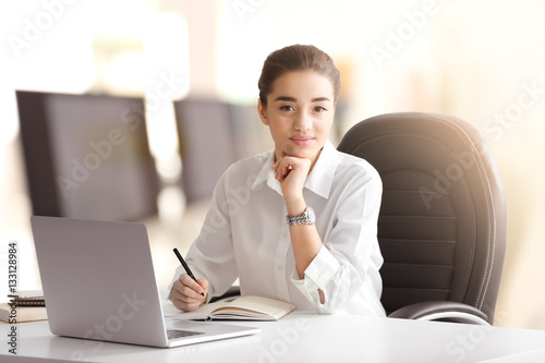 Young businesswoman working...