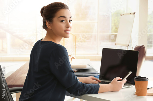 Young businesswoman working...