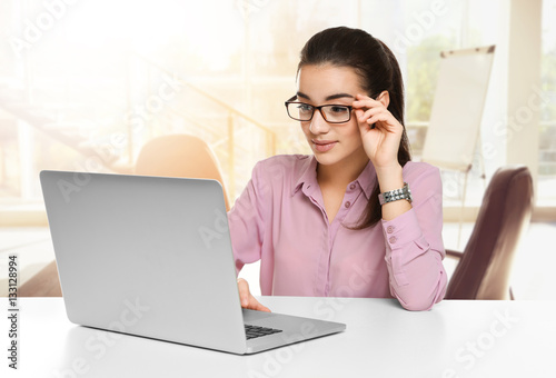 Young businesswoman working...