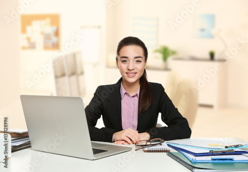 Young businesswoman working...
