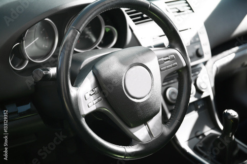 Steering wheel in car interior, closeup © Africa Studio