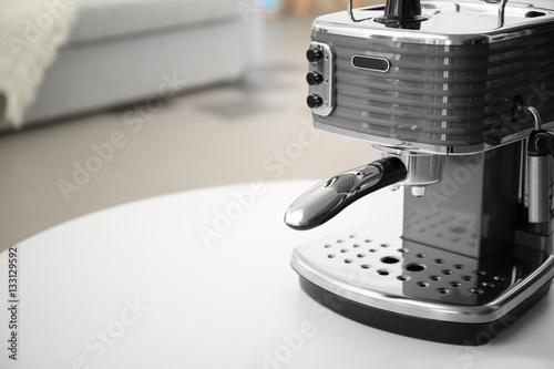 New electric coffee maker on table