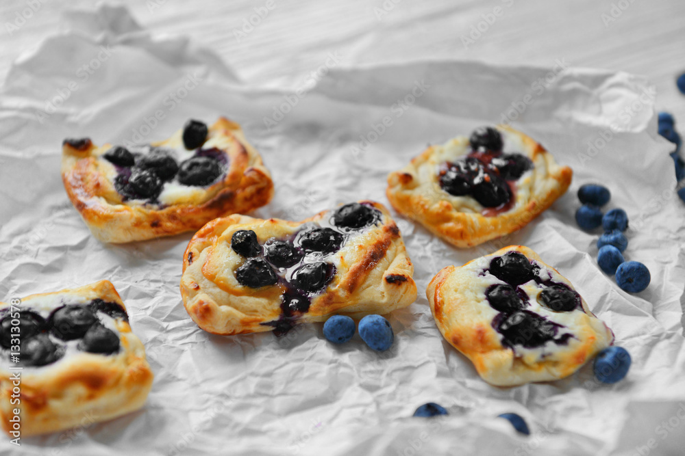 Sweet tasty pastries on craft paper, closeup