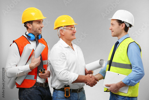 Senior engineer and workers...