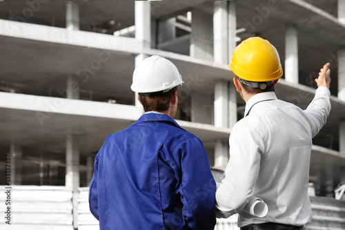 Engineer and worker discuss...