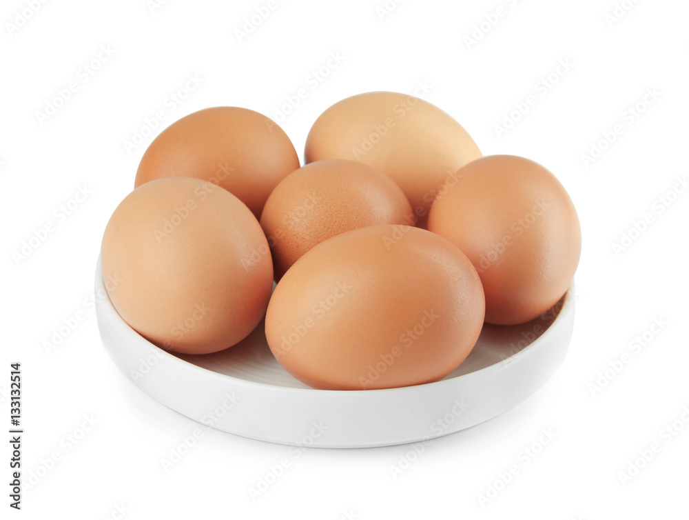 Raw eggs in plate on white background Raw eggs in plate on white background