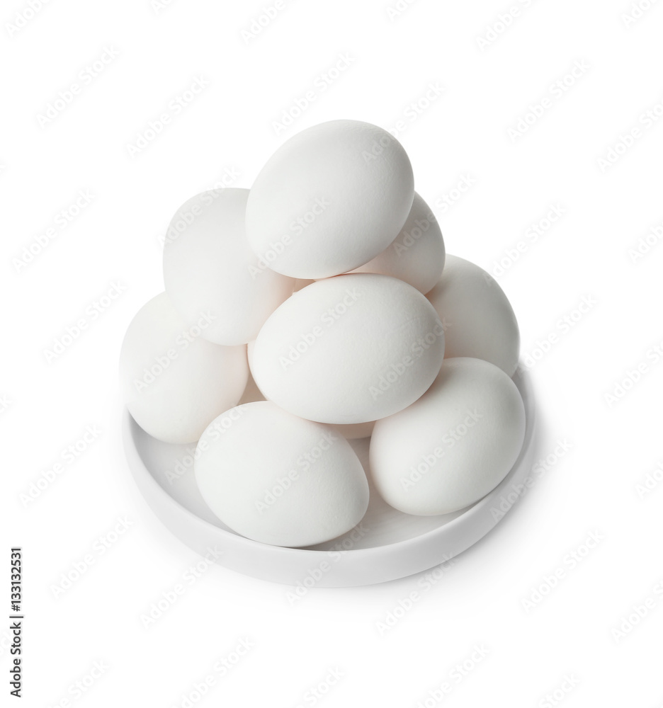 Raw eggs in plate on white background