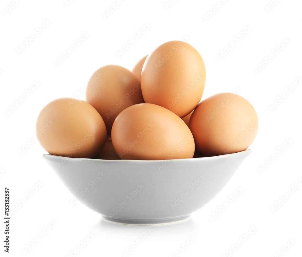 Raw eggs in bowl on white background Raw eggs in bowl on white background