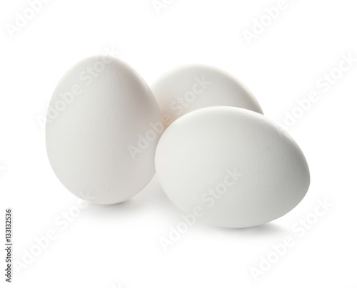 Raw eggs on white background
