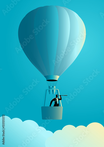 Businessman on air balloon using telescope