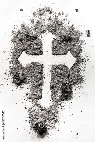 Christian holy cross symbol made in ash, dust