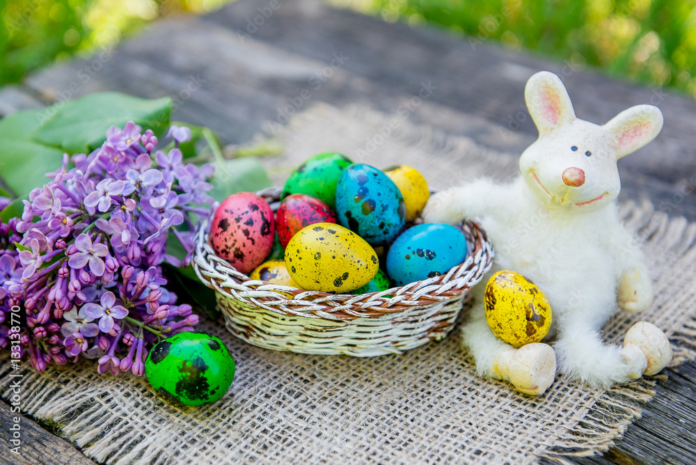 painted Easter eggs with bunny on grass background painted Easter eggs with bunny on grass background