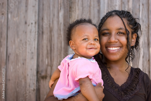 African American teenage mother and her daughter.