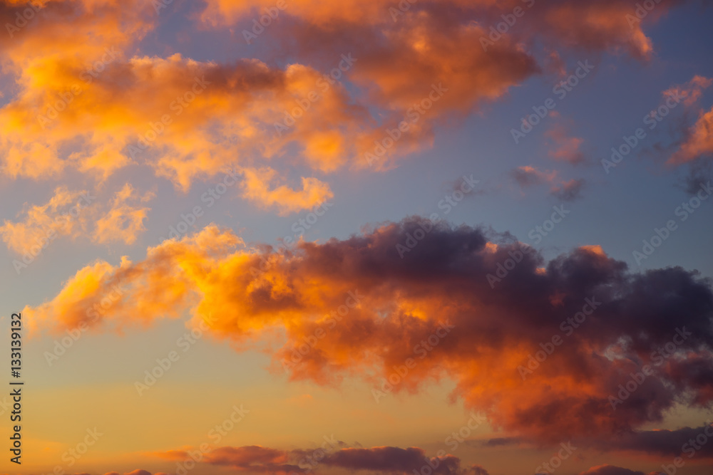 Fiery orange colorful sunset sky as background