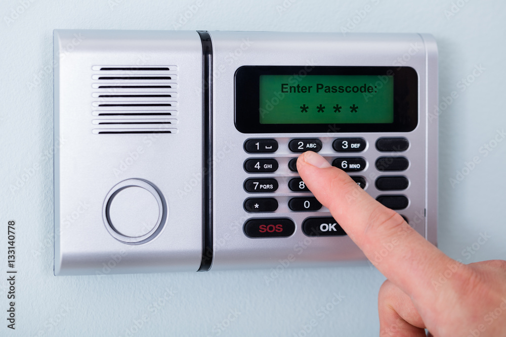 Person's Finger Entering Code In Security System Person's Finger Entering Code In Security System