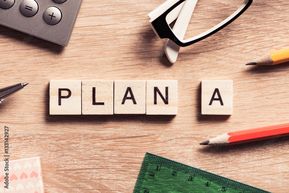 Conceptual business keywords on table with elements of game making crossword Conceptual business keywords on table with elements of game making crossword