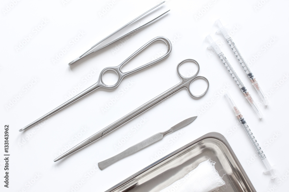 instruments for plastic surgery on white background top view instruments for plastic surgery on white background top view