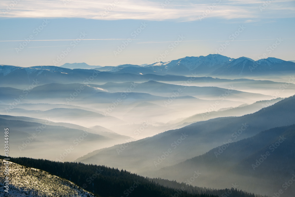 Winter mountain hills with fog