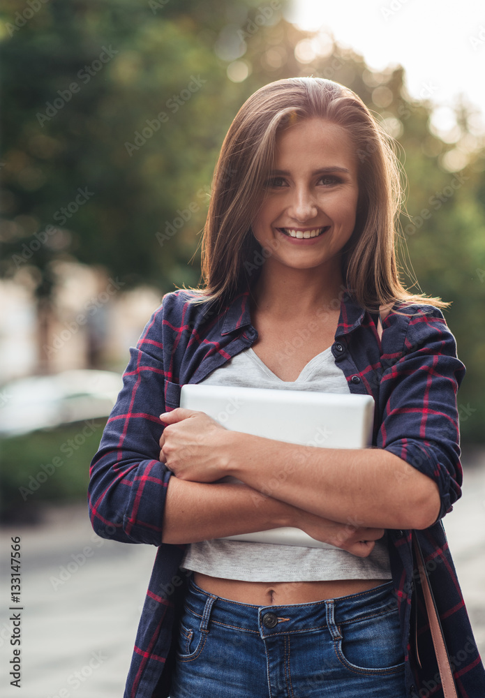 Young woman with her digital tablet in the city Young woman with her digital tablet in the city