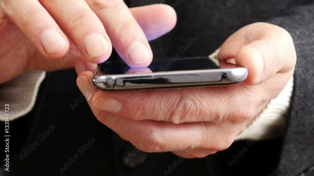 Businessman reading on mobile phone 4 K Businessman reading on mobile phone 4 K