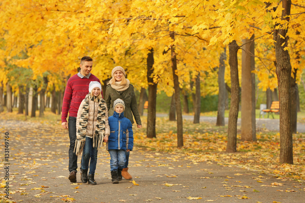 Happy family walking in beautiful autumn park Happy family walking in beautiful autumn park