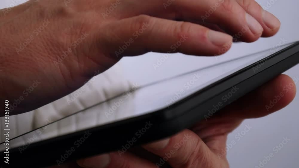 Businessman reading on tablet computer 4 K Businessman reading on tablet computer 4 K