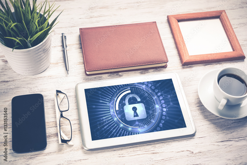 Web security and technology concept with tablet pc on wooden tab Web security and technology concept with tablet pc on wooden tab