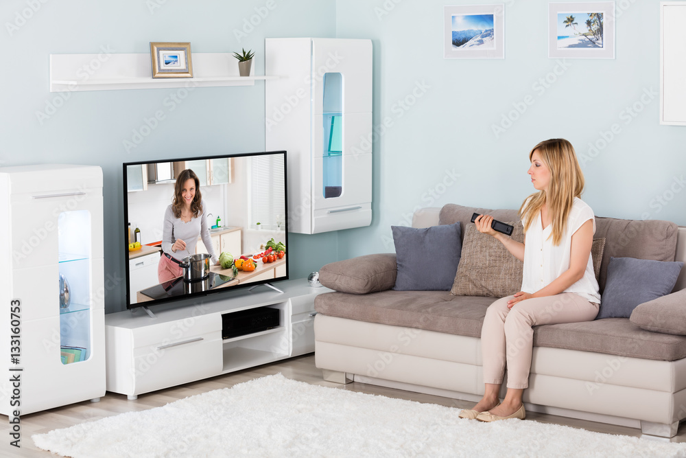 Woman Watching Television At Home Woman Watching Television At Home