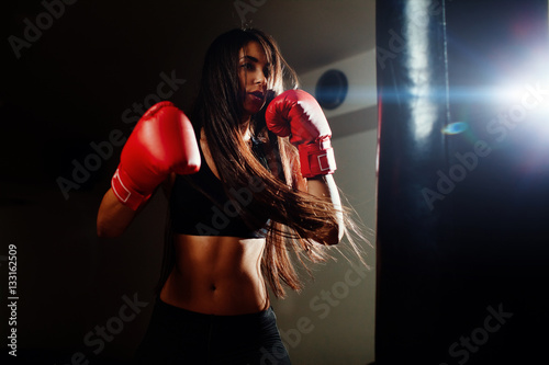 sexy fighter girl punching actively