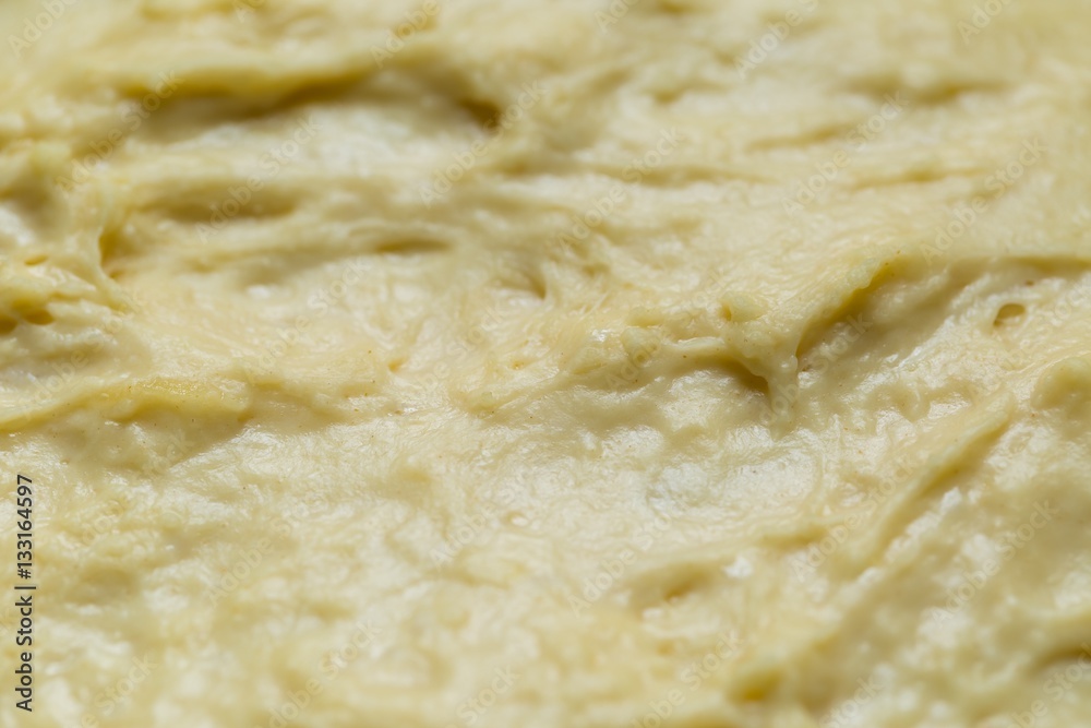 Raw yeast cake growing in bowl