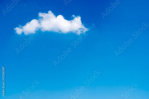 White clouds in a blue sky. Free space for text