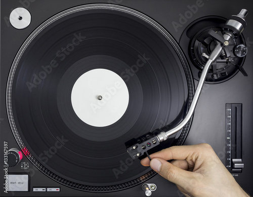 DJ Turntable, Hand Placing Tonearm on Vinyl Record, Top View