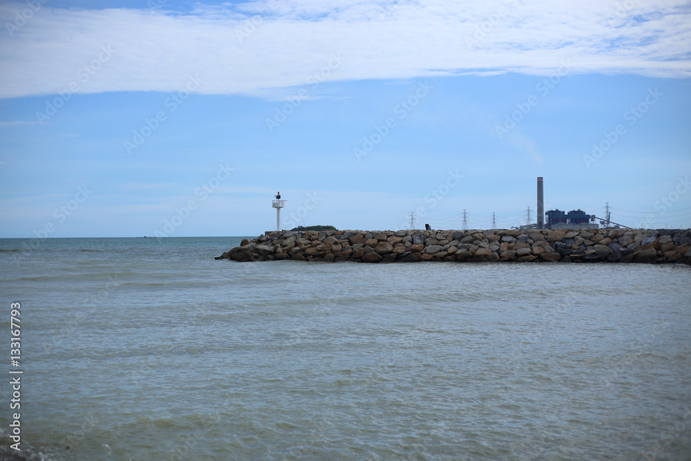 Rock breakwater and Blue sky in Rayong at Thailand