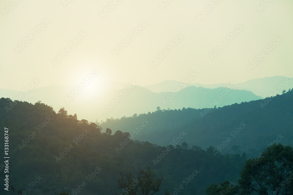 Sunset at the hills in the fog. Beautiful landscape background. Sunset at the hills in the fog. Beautiful landscape background.