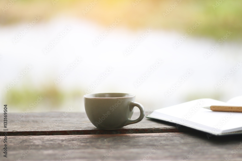 Stock Photo:.A cup of coffee on the wood table Stock Photo:.A cup of coffee on the wood table