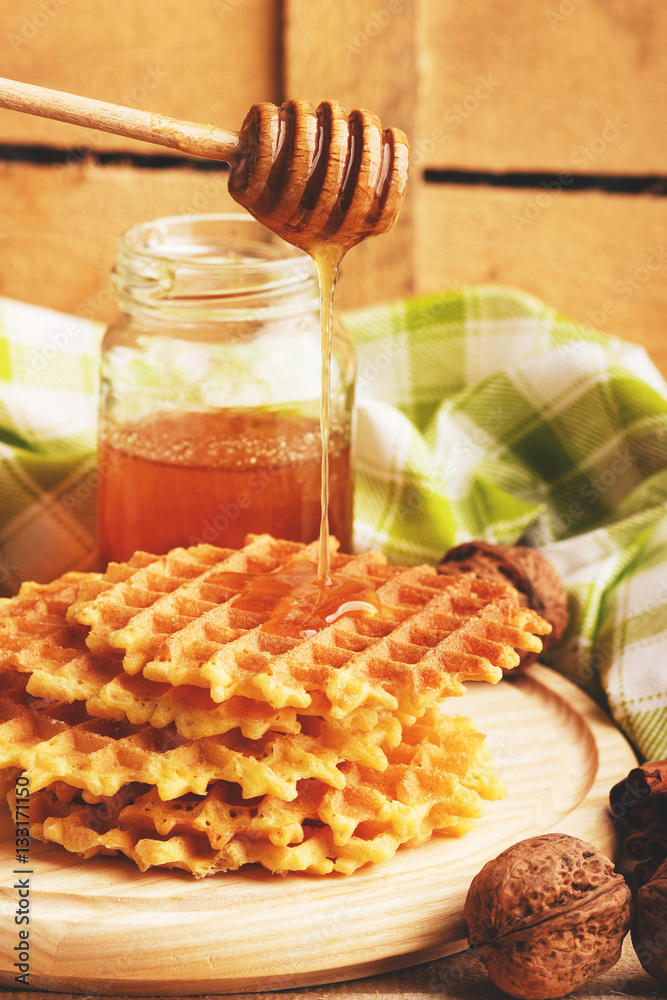 Waffles and glass with honey Waffles and glass with honey
