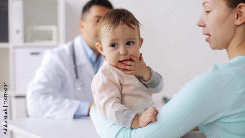 happy woman with baby and doctor at clinic happy woman with baby and doctor at clinic