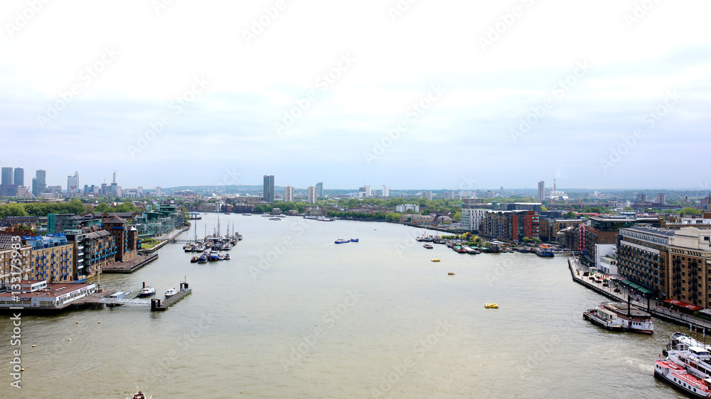 Beautiful breath-taking panoramic scenic view on London's cityscape from the Tower Bridge Exhibition. Spectacular view of the Docklands, Canary Wharf and Greenwich from the East Walkway.