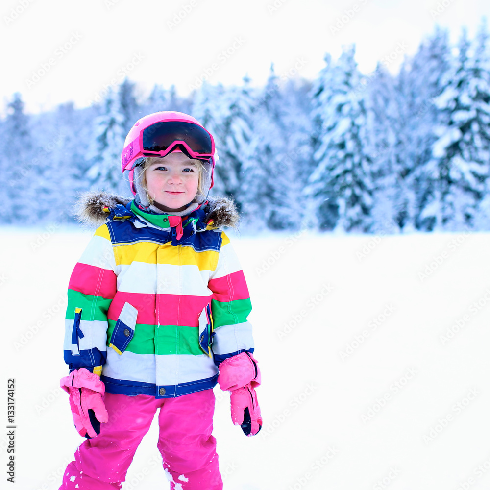 Happy child enjoying vacation in Alpine resort in Austria. Little girl skiing in mountains. Active sportive toddler learning to ski. Winter sport for family. Skier racing in snow. Happy child enjoying vacation in Alpine resort in Austria. Little girl skiing in mountains. Active sportive toddler learning to ski. Winter sport for family. Skier racing in snow.