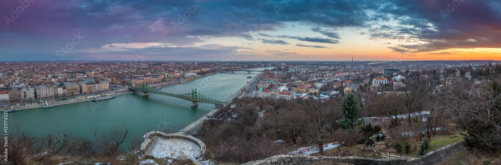 Budapest, Hungary - Beautiful sunset over the city of Budapest with River Danube, Szabadsag Bridge and Gellert Bath taken from Gellert Hill