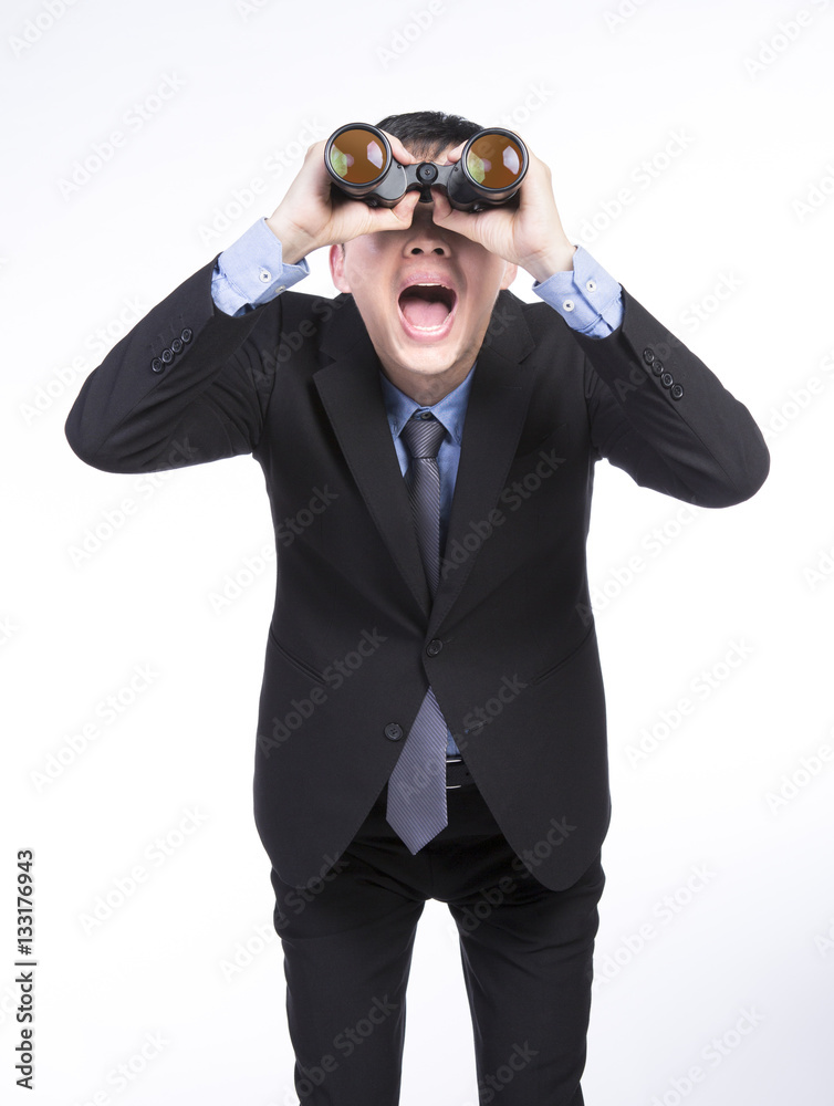 Asian businessman with binoculars Asian businessman with binoculars