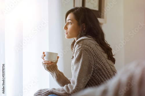 Woman thinking at home