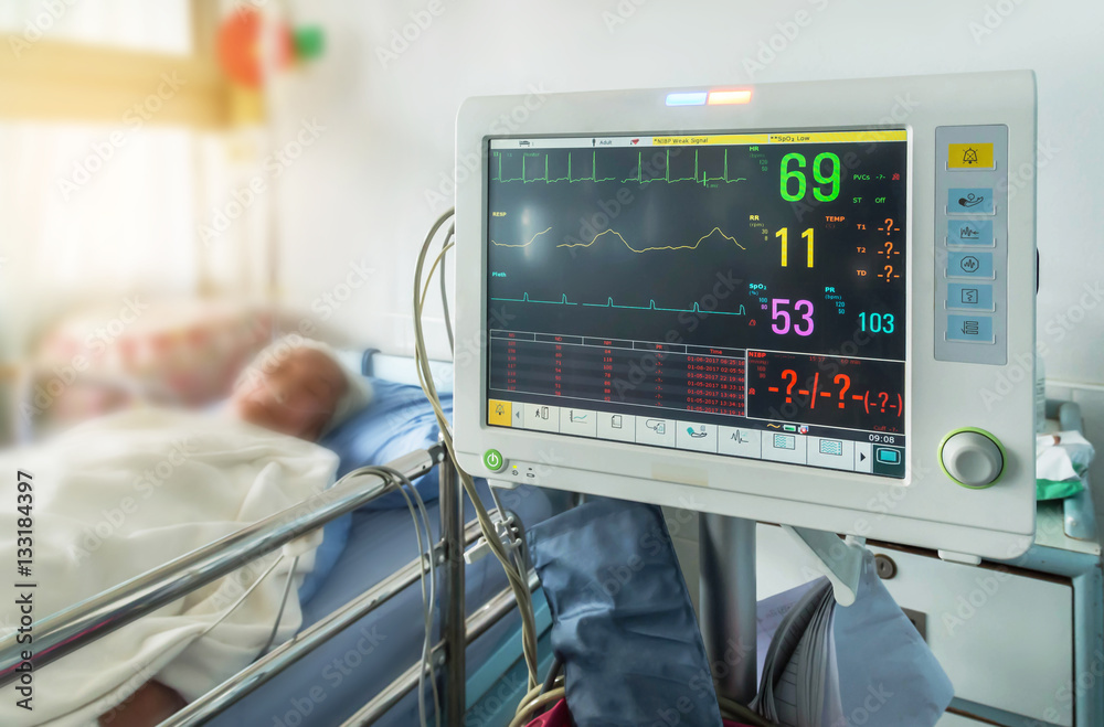 Close up digital device for measuring blood pressure monitor with elderly  patient sleep on the bed in hospital ward room Stock Photo | Adobe Stock