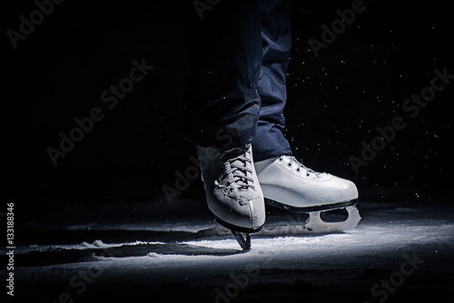 Tilted blue version, ice skates with reflection photo