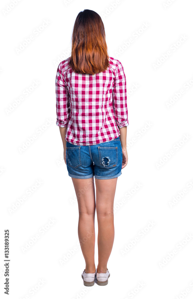 back view of standing young beautiful woman. girl watching. Rear view people collection. backside view of person. Girl in shorts and a plaid shirt, looking ahead. back view of standing young beautiful woman. girl watching. Rear view people collection. backside view of person. Girl in shorts and a plaid shirt, looking ahead.