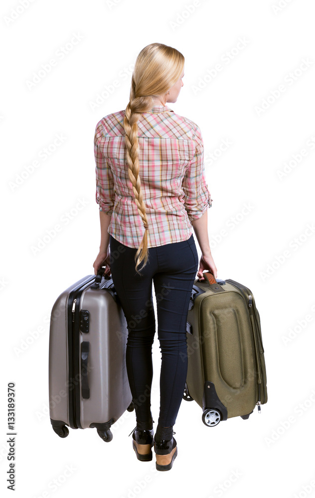 Back view of woman with suitcase looking up. Standing young girl. Rear view people collection. backside view of person. Isolated over white background. Long-haired girl holding two suitcases. Back view of woman with suitcase looking up. Standing young girl. Rear view people collection. backside view of person. Isolated over white background. Long-haired girl holding two suitcases.