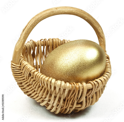 Easter Gold egg  in basket cart. White background isolated.